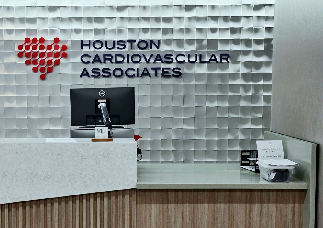 Professional reception desk of Houston Cardiovascular Associates, a leading cardiac practice located within the Museo Houston medical arts building.